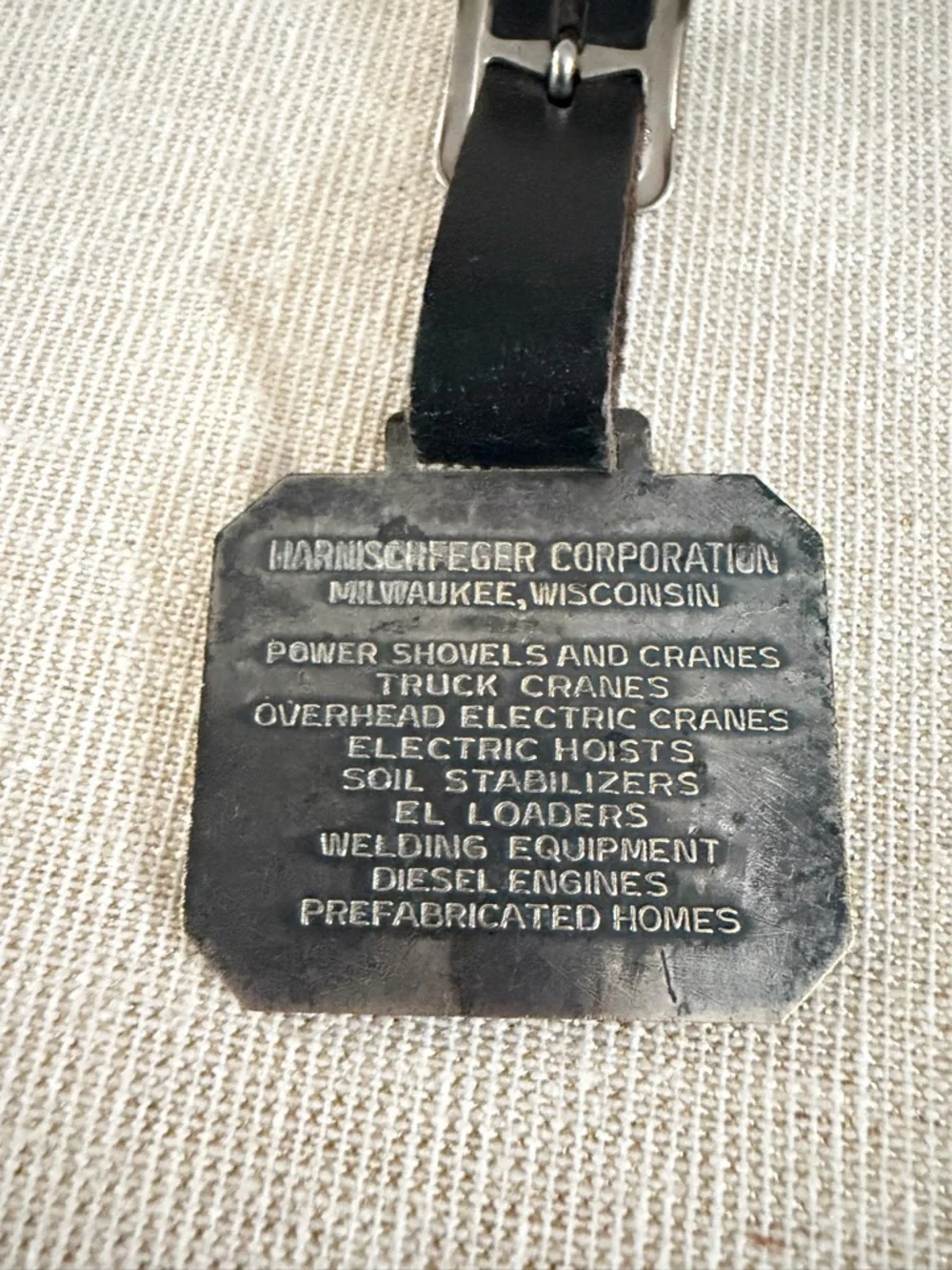 Black Leather Luggage Tag with Metal Excavator Emblem